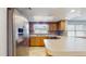 Kitchen with a stainless steel refrigerator and wrap around breakfast bar at 206 Hillcrest Dr, Safety Harbor, FL 34695