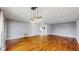 Bright living room with hardwood floors, stylish lighting, and closet storage at 206 Hillcrest Dr, Safety Harbor, FL 34695