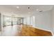Spacious living room featuring hardwood floors, sliding glass doors, and closet at 206 Hillcrest Dr, Safety Harbor, FL 34695