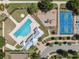 Community amenities including a pool, basketball court and playground shown from above at 2108 Delightful Dr, Ruskin, FL 33570