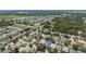 Expansive neighborhood with lush greenery and a mix of home styles, near wooded areas and a pond at 2108 Delightful Dr, Ruskin, FL 33570
