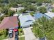 Aerial view of a home with a light gray roof, well-manicured lawn and driveway at 2108 Delightful Dr, Ruskin, FL 33570