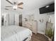 Relaxing bedroom space with dresser, ensuite, and natural light creating a comfortable retreat at 2108 Delightful Dr, Ruskin, FL 33570