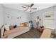 Bright bedroom with ceiling fan, modern floors, neutral color palette, and inviting window at 2108 Delightful Dr, Ruskin, FL 33570