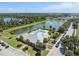 Neighborhood clubhouse with a pool and lake views, ideal for community gatherings at 2108 Delightful Dr, Ruskin, FL 33570