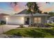 Charming single Gathering home with a two-car garage, manicured lawn, and a welcoming entrance at 2108 Delightful Dr, Ruskin, FL 33570