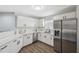 Updated kitchen features white cabinetry, stainless steel appliances, and ample counter space at 2108 Delightful Dr, Ruskin, FL 33570