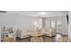 Bright living room features modern furniture, neutral tones, and wood-look floors at 2108 Delightful Dr, Ruskin, FL 33570