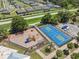 Community playground and basketball court with modern equipment and surrounding green spaces at 2108 Delightful Dr, Ruskin, FL 33570
