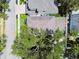 Aerial shot of a home with a leafy canopy, showing the roof, yard and driveway at 238 7Th S Ave, Safety Harbor, FL 34695