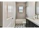 Bathroom featuring a shower/tub, dark vanity, mosaic floors, and light grey walls at 238 7Th S Ave, Safety Harbor, FL 34695