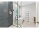 This bathroom boasts a glass enclosed shower, soaking tub, and stylish black and white tile flooring at 238 7Th S Ave, Safety Harbor, FL 34695