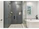 This bathroom features a glass enclosed shower with herringbone tile, and a large soaking tub at 238 7Th S Ave, Safety Harbor, FL 34695