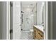 Bathroom featuring glass shower, decorative tile floor and wood vanity at 238 7Th S Ave, Safety Harbor, FL 34695