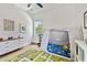 bedroom with a colorful carpet, window, teepee, and modern dresser at 238 7Th S Ave, Safety Harbor, FL 34695