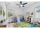 bedroom with a colorful carpet, window, teepee, fan, and toys at 238 7Th S Ave, Safety Harbor, FL 34695