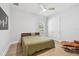 Bright bedroom with wood floors, a ceiling fan, and a double-door closet at 238 7Th S Ave, Safety Harbor, FL 34695