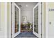 Elegant entryway showcasing a decorative rug and view into the home through double glass doors at 238 7Th S Ave, Safety Harbor, FL 34695