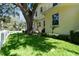 A charming home exterior, set back from the street featuring a well-manicured lawn at 238 7Th S Ave, Safety Harbor, FL 34695