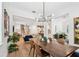 Spacious living area with an open floor plan, seamlessly connecting the dining area, living room, and kitchen at 238 7Th S Ave, Safety Harbor, FL 34695