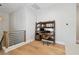Upstairs office area with wood floors, modern desk, shelving, and a comfortable rolling chair at 238 7Th S Ave, Safety Harbor, FL 34695