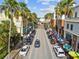 A vibrant downtown street featuring storefronts, palm trees, and street parking at 238 7Th S Ave, Safety Harbor, FL 34695