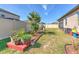 Spacious backyard featuring a white privacy fence, patio, and landscaping at 25200 Lambrusco Loop, Lutz, FL 33559