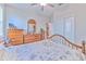 Cozy bedroom with wood furniture and large window, creating a warm and inviting atmosphere at 25200 Lambrusco Loop, Lutz, FL 33559