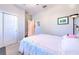 Comfortable bedroom featuring carpet, a closet, ceiling fan and neutral tones at 25200 Lambrusco Loop, Lutz, FL 33559