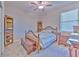 Cozy bedroom with wood furnishings, carpeted floors, and natural light, creating a comfortable and inviting space at 25200 Lambrusco Loop, Lutz, FL 33559