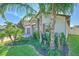 Single-Gathering home featuring a brick driveway and a well-maintained front lawn at 25200 Lambrusco Loop, Lutz, FL 33559