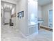 Welcoming foyer features neutral paint, decorative lighting, and tile flooring at 25200 Lambrusco Loop, Lutz, FL 33559