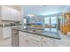 Kitchen island with double sink and stainless steel dishwasher at 25200 Lambrusco Loop, Lutz, FL 33559