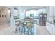 Spacious kitchen offers a large island with seating and updated appliances at 25200 Lambrusco Loop, Lutz, FL 33559
