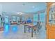 Open-concept living room features a large sectional sofa, neutral paint, and lots of light at 25200 Lambrusco Loop, Lutz, FL 33559
