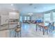 Open floorplan seamlessly connects kitchen, dining, and living areas at 25200 Lambrusco Loop, Lutz, FL 33559