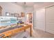 Well-lit office space with open doorway access to the bathroom and walk-in closet at 25200 Lambrusco Loop, Lutz, FL 33559