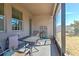 Screened-in patio with furniture at 25200 Lambrusco Loop, Lutz, FL 33559
