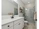 Bright bathroom featuring a glass-enclosed shower, and a white vanity at 2648 Lake Manor Dr, Land O Lakes, FL 34639