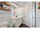 Stylish bathroom featuring subway tile, black hexagon flooring, and a sleek vanity at 2648 Lake Manor Dr, Land O Lakes, FL 34639