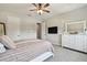 Spacious bedroom has neutral decor, a dresser with mirror, and carpet flooring at 2648 Lake Manor Dr, Land O Lakes, FL 34639