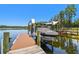 Boat lift on a private dock showcasing lakeside living at its finest at 2648 Lake Manor Dr, Land O Lakes, FL 34639