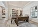 Cozy dining room with wood table, bench seating, a chandelier, and natural light at 2648 Lake Manor Dr, Land O Lakes, FL 34639