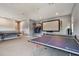 Large game room or entertainment area with ping pong table and basketball hoop at 2648 Lake Manor Dr, Land O Lakes, FL 34639