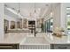 Bright kitchen featuring stone countertops and an island with seating at 2648 Lake Manor Dr, Land O Lakes, FL 34639