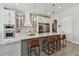 Modern kitchen featuring white cabinets, a center island, and stainless steel appliances at 2648 Lake Manor Dr, Land O Lakes, FL 34639