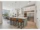Gourmet kitchen with stainless appliances, center island, and wine fridge at 2648 Lake Manor Dr, Land O Lakes, FL 34639