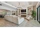 Cozy living room with fireplace and large comfortable couch at 2648 Lake Manor Dr, Land O Lakes, FL 34639