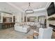 Large open-concept living space with view to kitchen and entry at 2648 Lake Manor Dr, Land O Lakes, FL 34639
