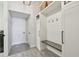 This mudroom features built-in storage and bench seat, perfect for organizing coats and shoes at 2648 Lake Manor Dr, Land O Lakes, FL 34639
